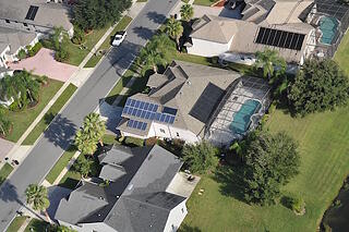 Aerial View of Solar Panels Installed on Homes