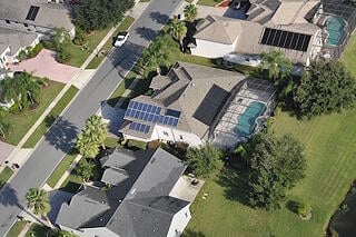 Aerial View of Solar Panels Installed on Homes