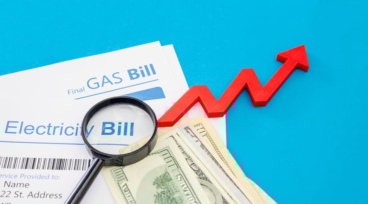 electricity-and-gas-bills-and-us-dollars-banknotes-2022-12-16-12-26-12-utc